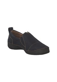 Chaussure décontractée noire à enfiler avec surpiqûres beige, bout arrondi, semelle rembourrée et languette au talon, vue en angle sur fond blanc.