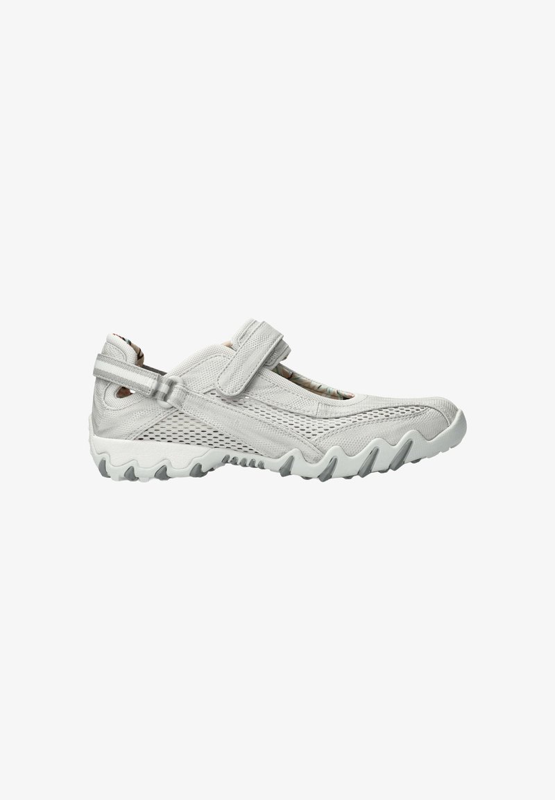 Light gray athletic shoe with a mesh upper, adjustable Velcro strap, textured sole, and wavy rubber outsole for grip.
