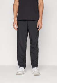 adidas Sportswear - ESSENTIALS 3-STRIPES STANFORD OPEN HEM - Tracksuit bottoms - black/white Thumbnail Image 1