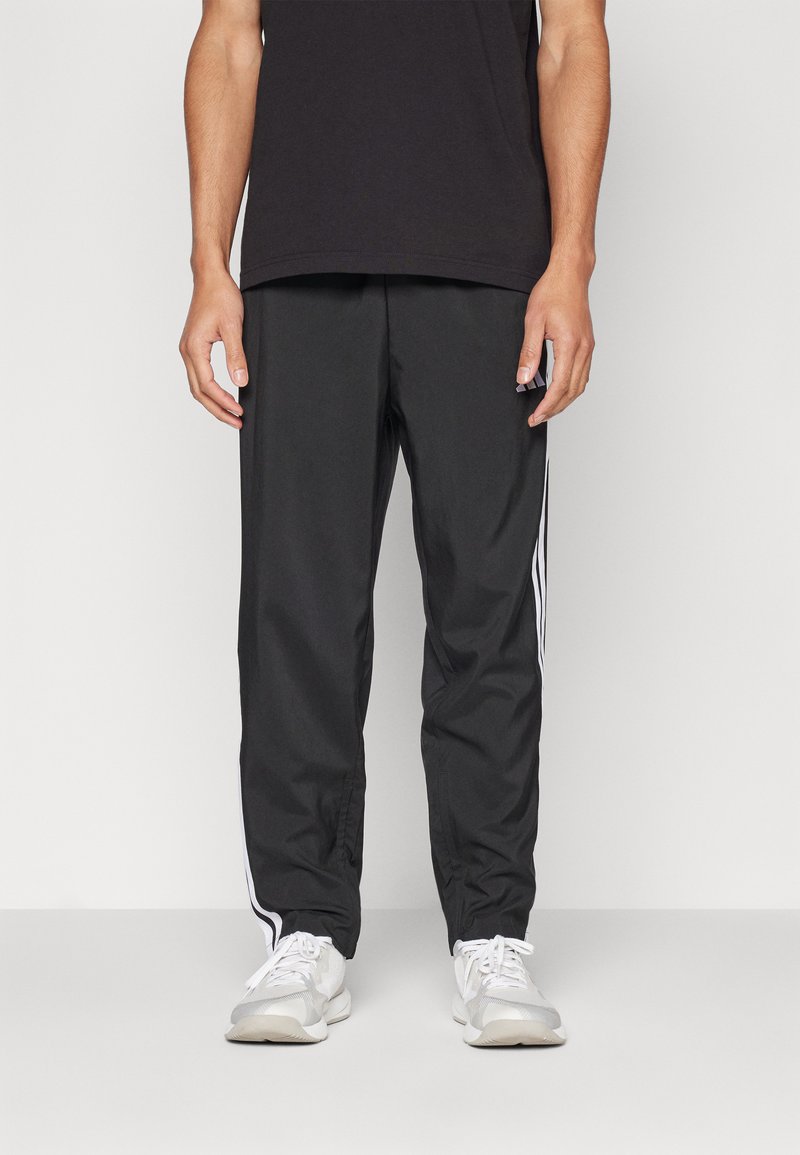 adidas Sportswear - ESSENTIALS 3-STRIPES STANFORD OPEN HEM - Tracksuit bottoms - black/white, Enlarge