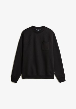 Black sweatshirt made of soft fabric, featuring a crew neck, long sleeves, and a front pocket on the left side. Simple design and solid color.