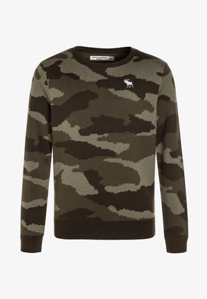 Pull camouflage vert olive avec un col rond, fabriqué en tissu tricoté. Présente un petit logo de majesté blanc sur la poitrine et des poignets côtelés.