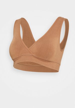 Brown seamless bralette with a V-neck design, wide straps, and a textured finish. Soft fabric provides stretch and comfort.