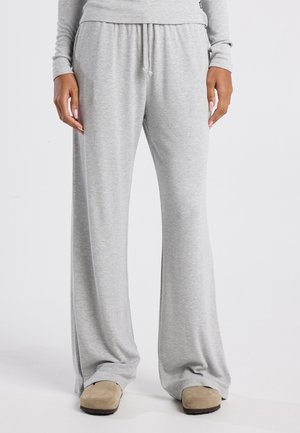 Graue Freizeithosen mit lockerer Passform, aus weichem Stoff gefertigt. Sie verfügen über einen elastischen Bund mit Kordelzug und schmal zulaufenden Beinen.