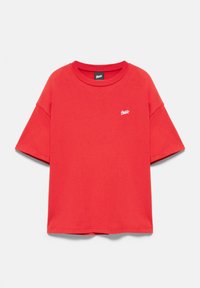 Red short-sleeve crew neck t-shirt with small white logo on left chest and black brand label inside neckline.