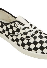 Low-top Vans sneaker with black and white checkered pattern, white laces, and white rubber sole, angled to show side and top.