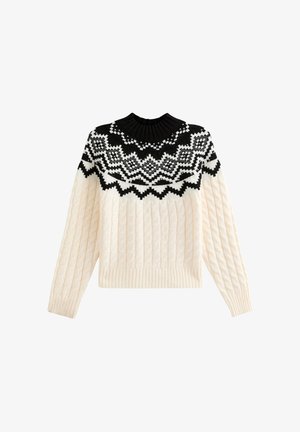 Chunky stickad tröja i crème med en svart mönstrad ok. Har en ribbad halsringning och fåll, med en texturerad kabelstickad design.