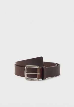 Brown leather belt with a silver metal buckle, featuring a subtle textured pattern and red stitching detail near the buckle.