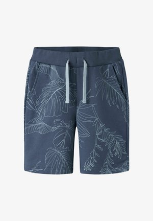 Short bleu marine avec motifs linéaires botaniques bleu clair, taille côtelée, cordons gris et poches latérales avant.