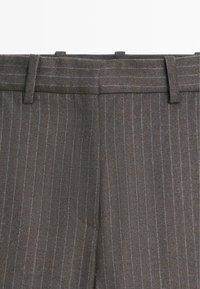 Gray pinstripe trousers featuring a tailored waistband, belt loops, and subtle texture. Distinctive blue and white stripes run vertically.