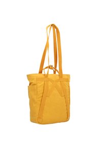 Borsa a tracolla in tessuto giallo con lunga tracolla, dotata di chiusura superiore e tasca frontale. Materiale testurizzato e design minimalista.