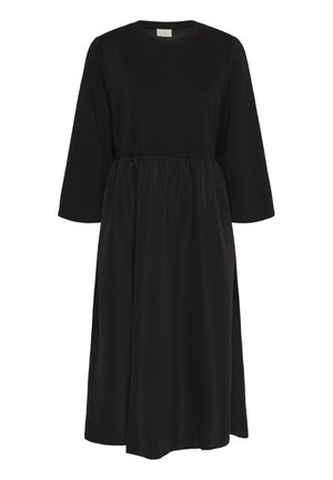 Fekete ruha kerek nyakkivágással és háromnegyedes ujjakkal. Testhez simuló felsőrésze és redőzött szoknyája laza sziluettet biztosít. Puha anyagból.