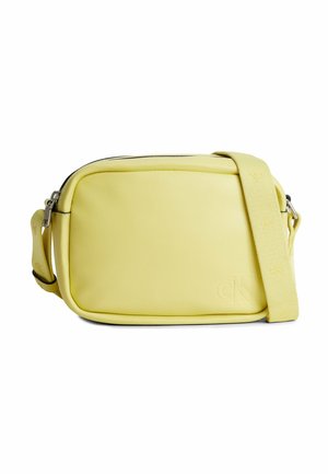 Yellow leather crossbody bag with a rectangular shape, smooth texture, and a logo detail on the front. Features a fabric shoulder strap.