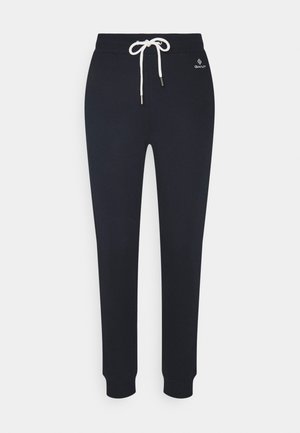 Marineblå, tilspidsede sweatpants med hvid snørelukning i taljen og lille GANT-logo på øvre venstre hofte.