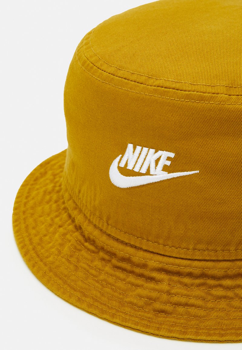 white and gold nike hat