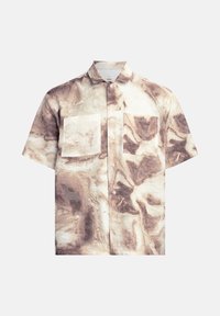 Kortærmet skjorte i et marmoriseret creme- og brunmønster, der har to brystlommer og krave med knapper. Struktureret stof.