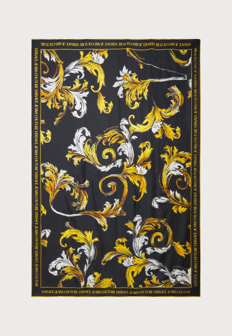 Melna šalle ar sarežģītiem dzelteniem un baltiem ziedu rakstiem un kontrastējošu apmalīti ar "Versace Jeans Couture" tekstu. Mīksts, gluds materiāls.