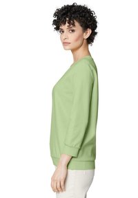 Lichtgroene sweatshirt met een ronde halslijn, driekwart mouwen en een losse pasvorm, gemaakt van zachte, gestructureerde stof.