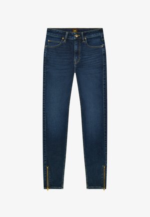 Ciemnoniebieskie obcisłe dżinsy z przednimi kieszeniami, szlufkami na pasek, zapięciem na guzik oraz złotymi suwakami przy mankietach nogawek.