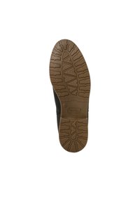 Schwarze Schuhsohle aus strukturiertem braunem Gummi mit einem Profilmuster für Griffigkeit und einem rechteckigen Logo, das in der Mitte eingeprägt ist.