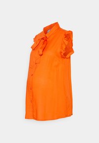 Blusa de maternidade laranja com mangas curtas e com babados, frente com botões e decote amarrado. Tecido liso e leve com um corte descontraído.