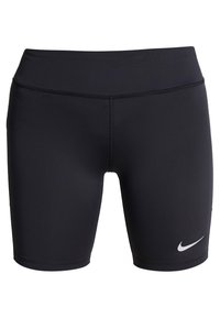 Černé sportovní šortky s těsným střih a širokým pasem, s bílým logem Nike swoosh na dolní straně levé nohy.