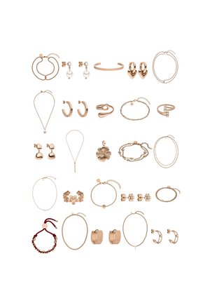 Collection of rose gold jewelry including necklaces, bracelets, earrings, and rings, featuring varied shapes, textures, and designs.