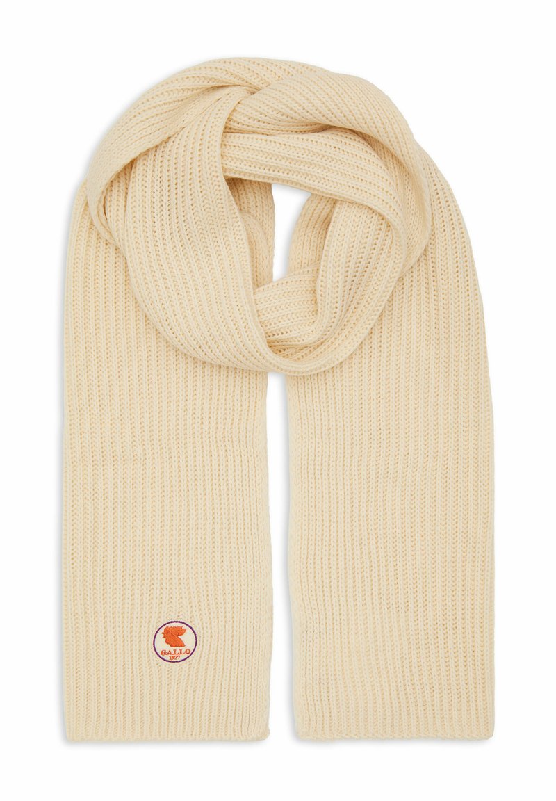 Scarf a coste di colore crema realizzata in morbido materiale lavorato a maglia, con un patch circolare del logo in viola e arancione vicino a un'estremità.