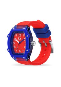 Rote und blaue Silikon-Uhr mit quadratischem Ziffernblatt, durchsichtigem Gehäuse, großen weißen Ziffern und silbernen Beschlägen an einem strukturierten Armband.