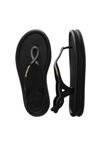 Tongs Havaianas noires avec semelles texturées et fines lanières d’orteils, montrées en vues de dessus et de côté sur fond blanc.