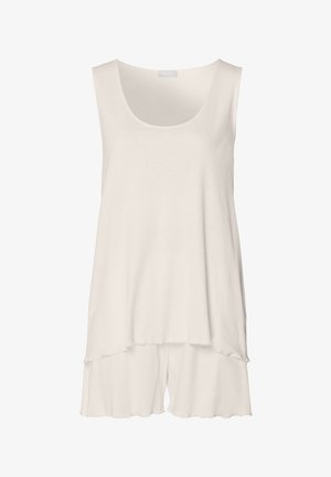 Luźna, bezrękawnikowa bluzka w kolorze off-white, z okrągłym dekoltem, warstwowym dołem i delikatnie zaokrąglonymi brzegami. Gładka faktura.