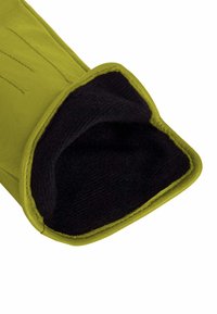 Green leather glove with a black, textured lining. The opening is rounded, featuring visible stitching along the edges.