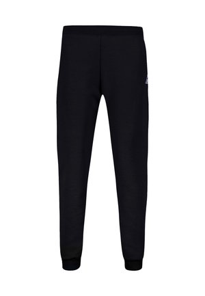 Pantaloni della tuta neri realizzati in tessuto morbido, con vita e polsini elasticizzati, e un piccolo logo nella parte superiore sinistra.