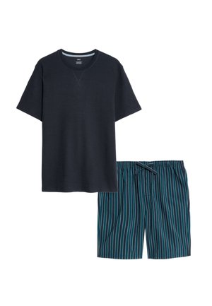 Marineblauwe T-shirt met korte mouwen en een textuur, gecombineerd met teal-kleurige shorts met verticale strepen en een kleine strik aan de voorkant.