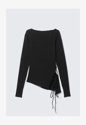 Black long-sleeve top with a boat neckline, asymmetrical design, and side ties for adjustable fit. Soft, stretchy fabric with a smooth texture.