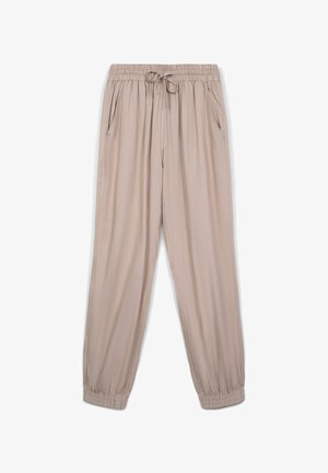 Pantaloni jogger leggeri beige con vita elasticizzata, coulisse, tasche laterali e polsini elastici, caratterizzati da una texture liscia e una vestibilità ampia.