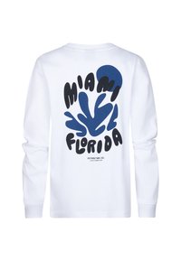 T-shirt bianca a maniche lunghe con design astratto blu e testo in grassetto nero "MIAMI FLORIDA" sul retro, con collo rotondo e polsini.