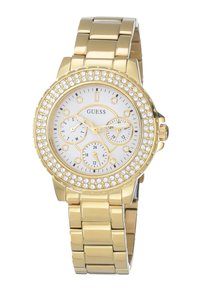 Kultakristallinen kello, jossa on pyöreä valkoinen kellotaulu, kolme alikelloa, kirkkaat kristallikoristeet kehällä ja kiillotettu metallinen ranneke.