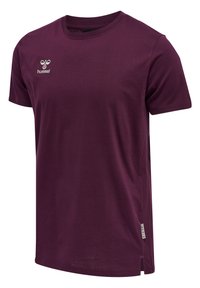 Lilla bomulds t-shirt med rund hals, korte ærmer og "hummel" logo broderet på brystet. Side-slids detaljer.