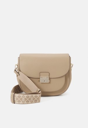 Beige leather crossbody bag with front flap, gold-tone lock, and wide adjustable fabric strap patterned with geometric shapes.