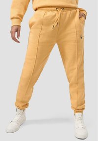 Karl Kani REGULAR FIT - Joggebukse - apricot