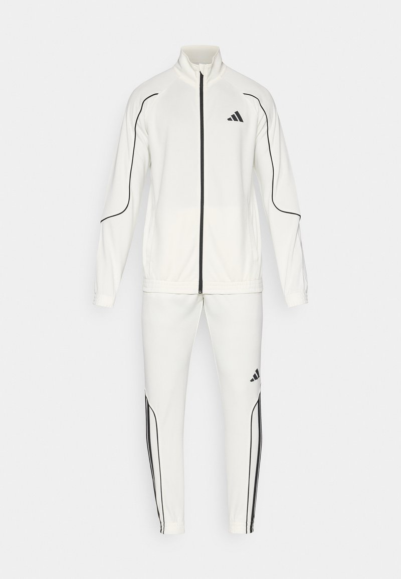 Matching track jacket and pants viewed together for shade comparison