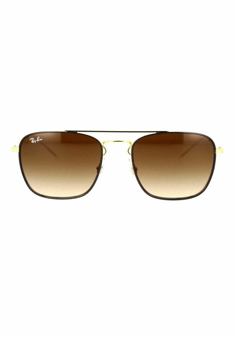 Lenti sfumate marroni a forma rettangolare, con una sottile montatura in metallo dorato. Logo del brand sulla lente superiore sinistra. Pad nasali in plastica trasparente.