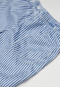 Blue and white striped shorts with an elastic waistband, featuring a single back pocket, made of lightweight fabric with a smooth texture.