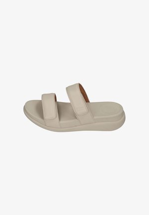 Light beige slide sandal featuring two adjustable straps, a cushioned footbed, and a thick rubber sole for comfort and stability.