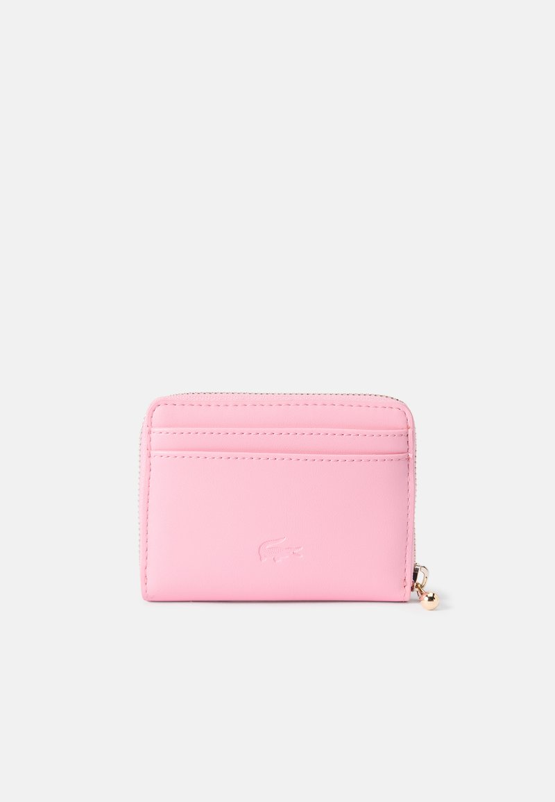Pink leather wallet with a smooth texture, featuring multiple card slots, a zippered compartment, and embossed logo detail.