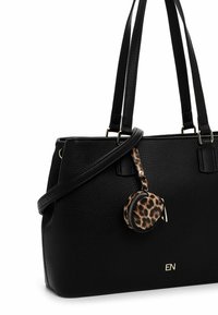 Black textured leather handbag with dual handles, adjustable strap, and a small leopard print coin purse attached. Features gold accents.