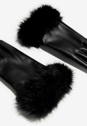 Juodi odiniai pirštinės su minkštu juodu dirbtiniu kailio kraštu. Plonas dizainas su lygiu paviršiumi, turintis tris pirštų angas.