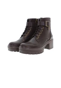 Botine din piele maro, cu toc bloc, front cu șireturi, fermoar pe lateral și accente din metal de culoare aurie. Talpă groasă din cauciuc texturat.