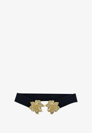 Cintura elastica nera con due fibbie decorative a forma di fiore in oro, dotate di petali dettagliati e finitura liscia.